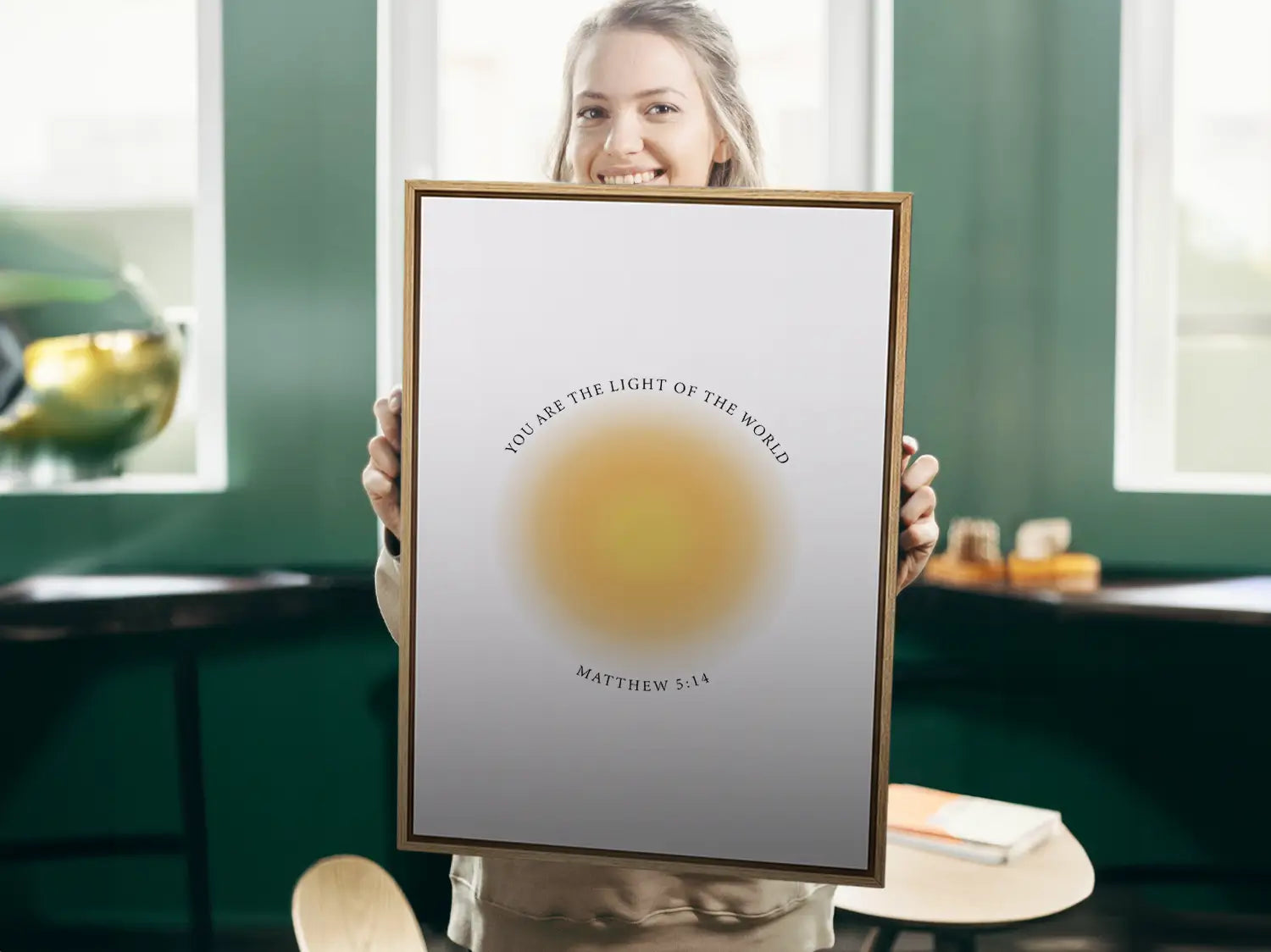 Shine brightly and inspire others with this powerful Christian canvas wall art. This framed canvas print features a modern, ethereal "aura" design and the profound command from Matthew 5:14: "You are the light of the world."