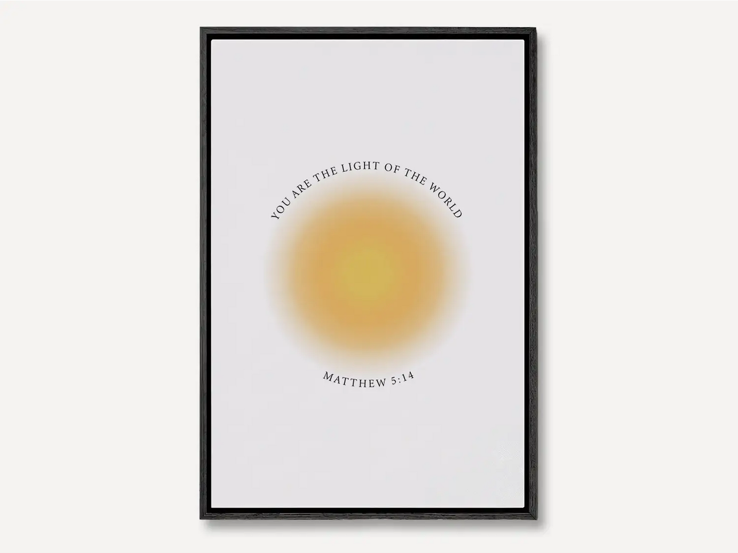 Shine brightly and inspire others with this powerful Christian canvas wall art. This framed canvas print features a modern, ethereal "aura" design and the profound command from Matthew 5:14: "You are the light of the world."