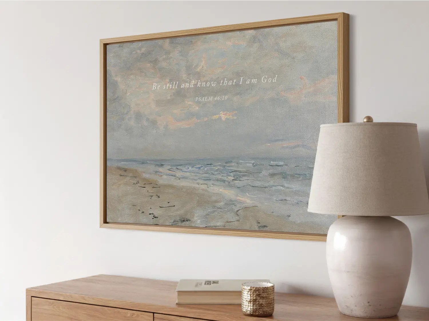 Invite calm and faith into your home with this inspiring Christian wall art. This framed print features a serene coastal landscape paired with the powerful, comforting command from Psalm 46:10 to Be Still and Know That I Am God.