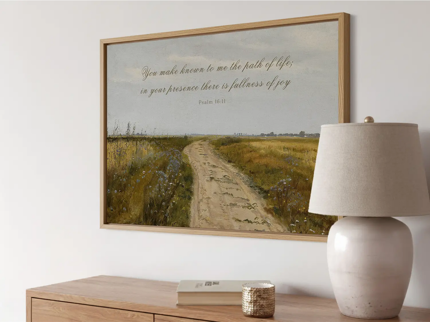 Discover fullness of joy in God's presence with this inspiring Christian wall art. This framed print features a beautiful, rustic landscape painting paired with the comforting promise from Psalm 16:11.