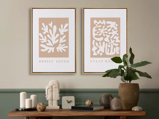 Decorate with faith and style using this inspiring, modern Christian wall art set. This collection of two framed abstract prints features a contemporary design and the comforting truth that you are Deeply Loved & Fully Known by God.