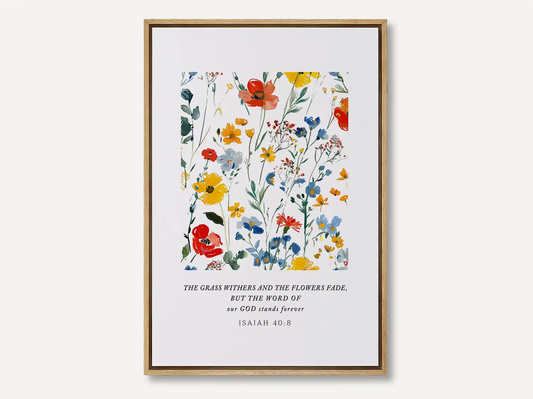 Anchor your hope in unchanging truth with this inspiring Christian canvas wall art. This framed canvas print features a vibrant watercolor floral design paired with the powerful promise from Isaiah 40:8: "The word of our God will stand forever."