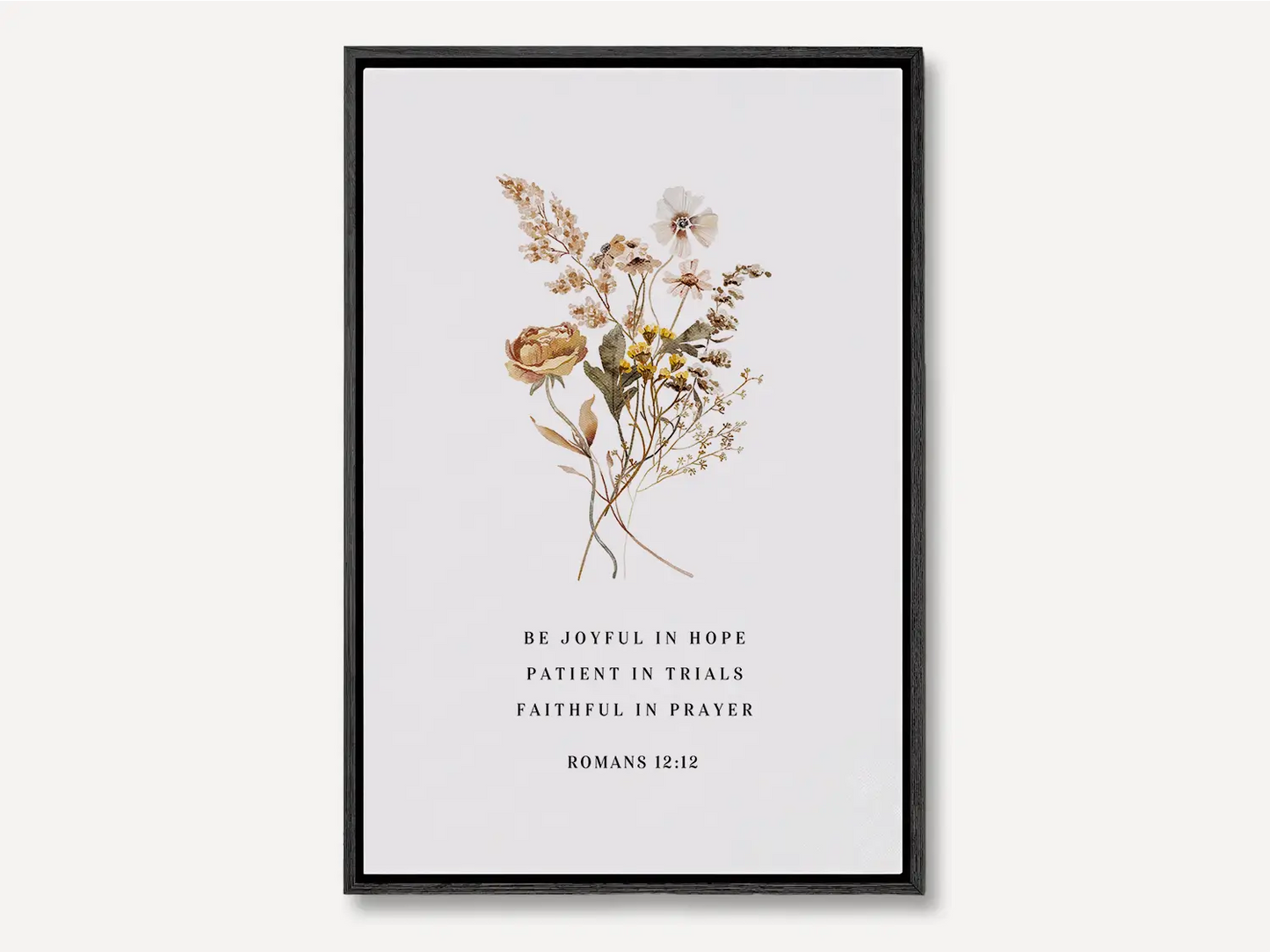 Anchor your heart in hope and resilience with this inspiring Christian canvas wall art. This framed canvas print features a beautiful pressed floral illustration paired with the powerful encouragement from Romans 12:12 to be joyful, patient, and faithful.