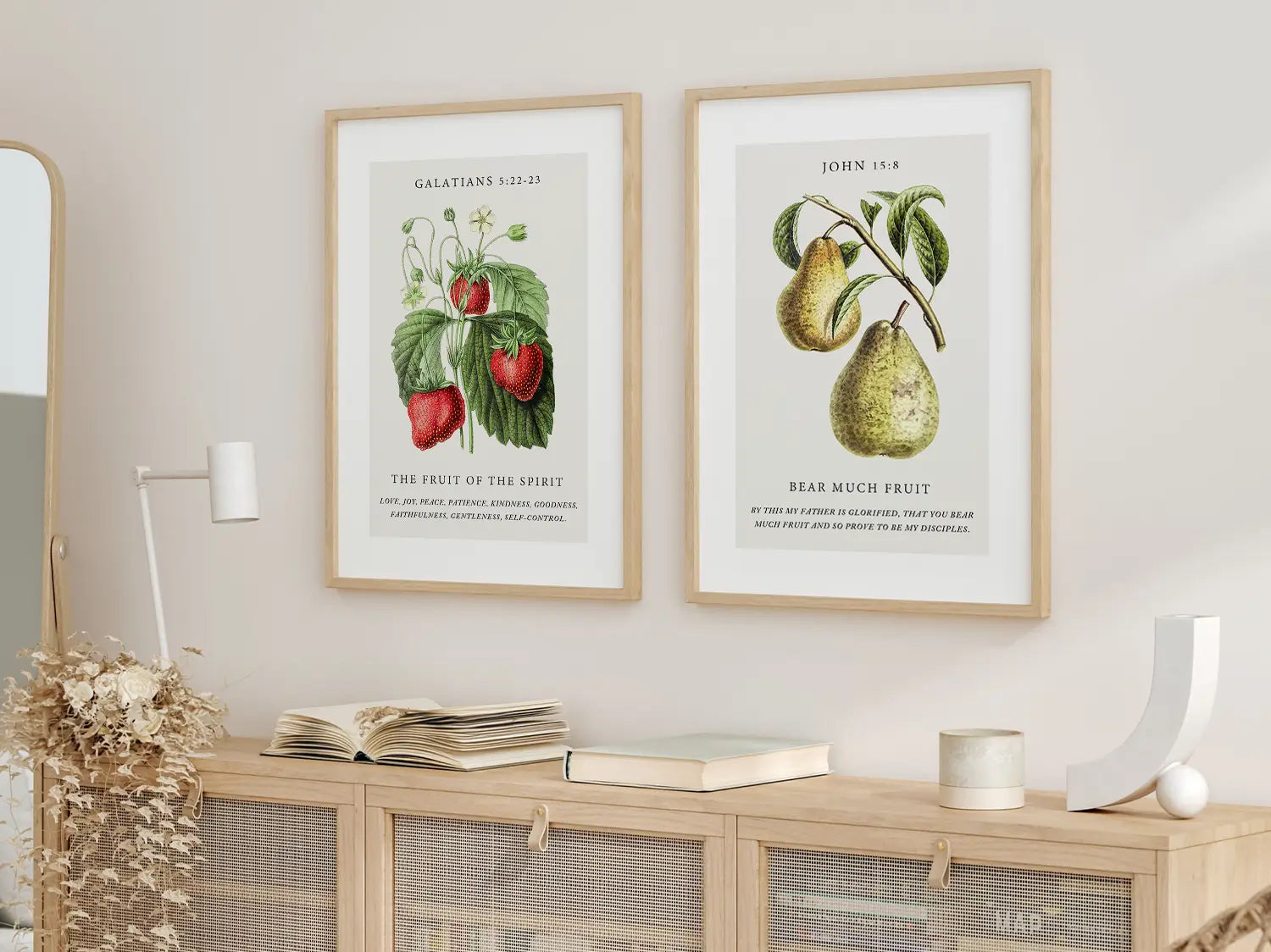Decorate your home with this beautiful Christian wall art set. This collection of two framed botanical prints features detailed illustrations of fruit, paired with powerful verses on the Fruit of the Spirit and bearing spiritual fruit.