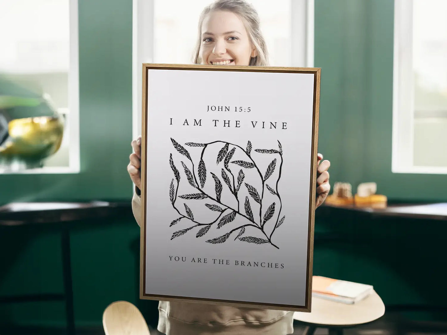 Anchor your home in the source of life and fruitfulness with this inspiring Christian canvas wall art. This framed canvas print features a modern, hand-drawn vine illustration and the essential truth from John 15:5: "I am the vine; you are the branches."