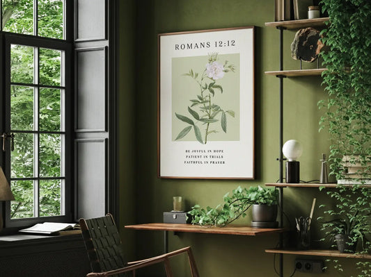 Anchor your heart in hope and resilience with this inspiring Christian canvas wall art. This framed canvas print features a calming botanical illustration paired with the powerful encouragement from Romans 12:12 to be joyful, patient, and faithful.