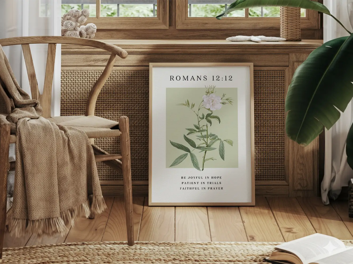 Anchor your heart in hope and resilience with this inspiring Christian canvas wall art. This framed canvas print features a calming botanical illustration paired with the powerful encouragement from Romans 12:12 to be joyful, patient, and faithful.
