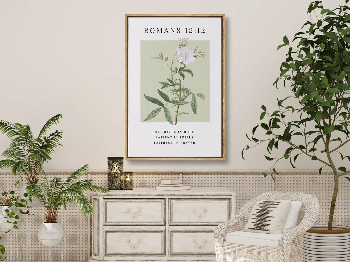 Anchor your heart in hope and resilience with this inspiring Christian canvas wall art. This framed canvas print features a calming botanical illustration paired with the powerful encouragement from Romans 12:12 to be joyful, patient, and faithful.