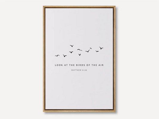 Invite the gentle wisdom of God's perfect care into your home with this inspiring Christian canvas wall art. This framed canvas print features a peaceful, minimalist design of flying birds and the comforting teaching from Matthew 6:26.