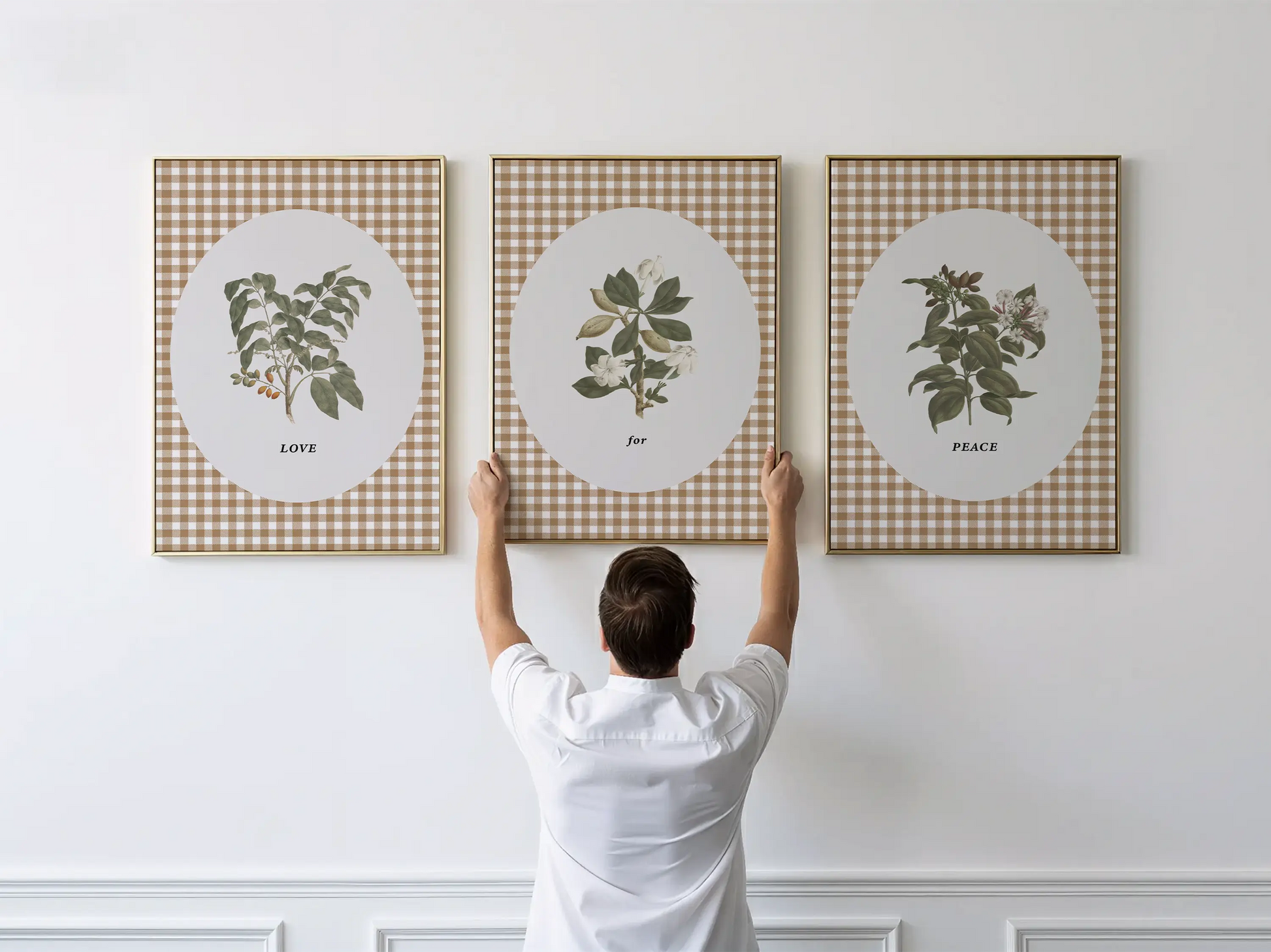 Add a touch of farmhouse charm with this inspiring Christian wall art set. This collection of three framed botanical prints features a chic gingham background and the simple, profound message: LOVE for PEACE, bringing warmth and grace to your home.