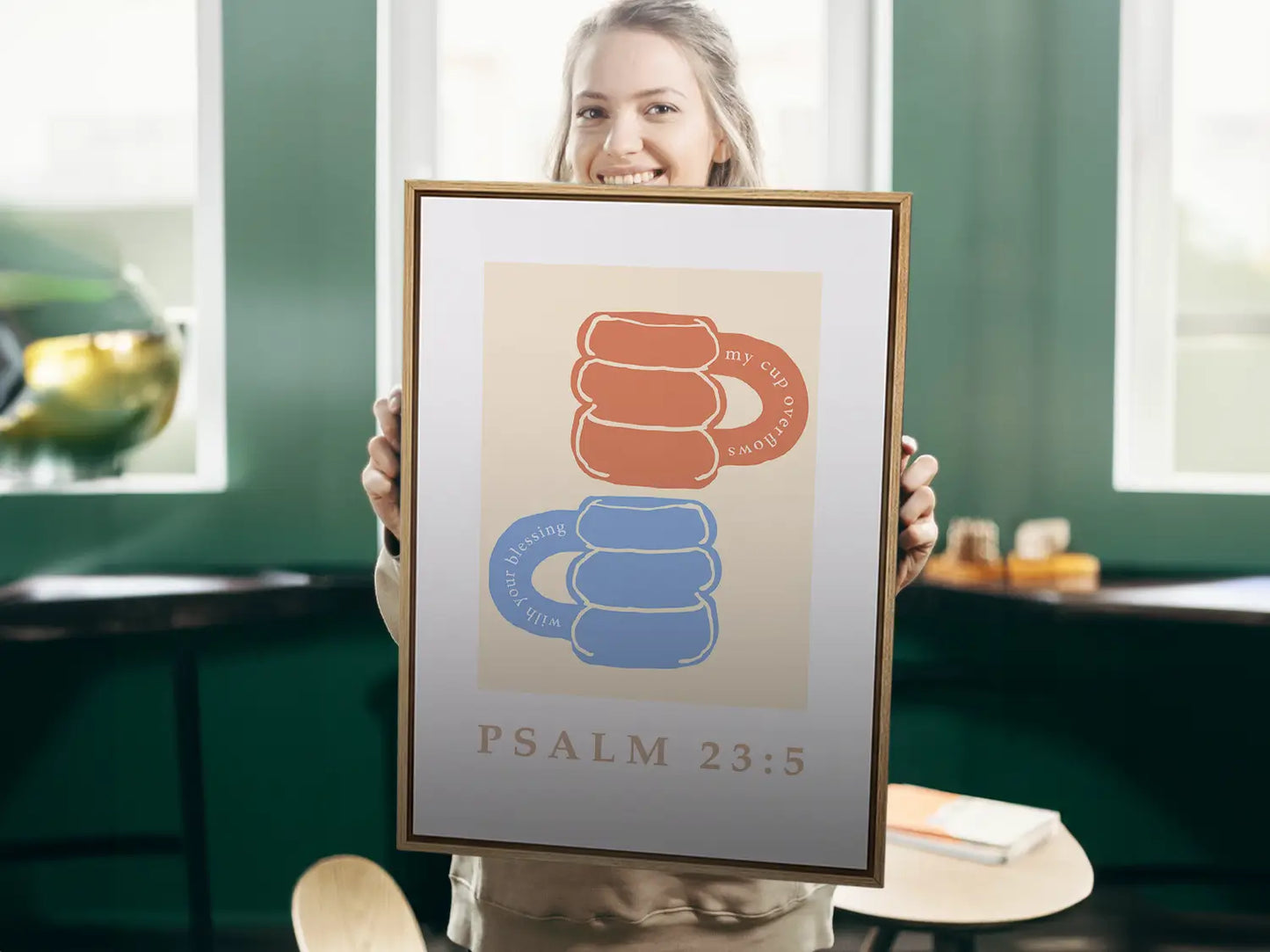 Celebrate abundant blessings with this inspiring Christian canvas wall art. This framed canvas print features a joyful, abstract design of stacked mugs and the comforting promise from Psalm 23:5 that your cup overflows.
