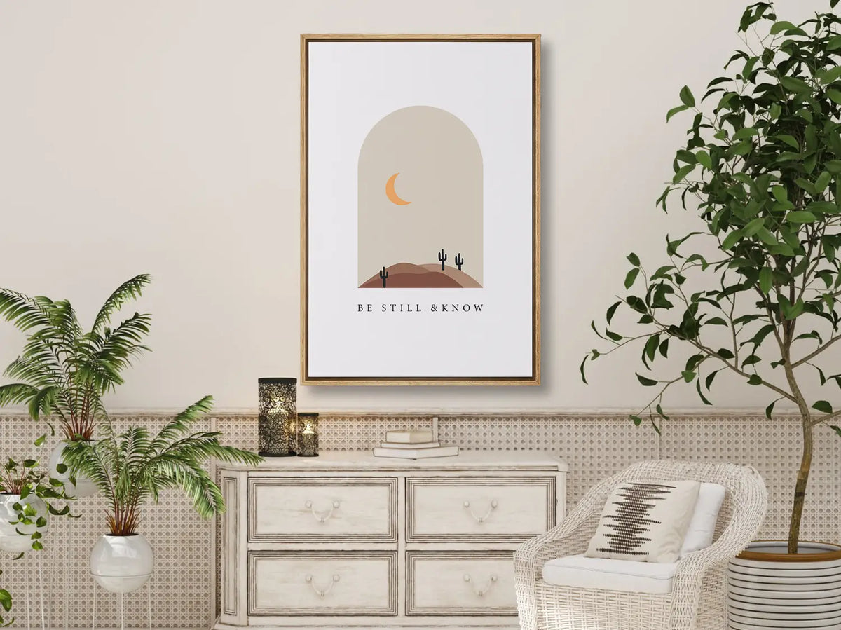 Find calm and faith in modern style with this inspiring Christian canvas wall art. This framed canvas print features a peaceful, minimalist desert landscape and the powerful, comforting command from Psalm 46:10 to Be Still & Know.