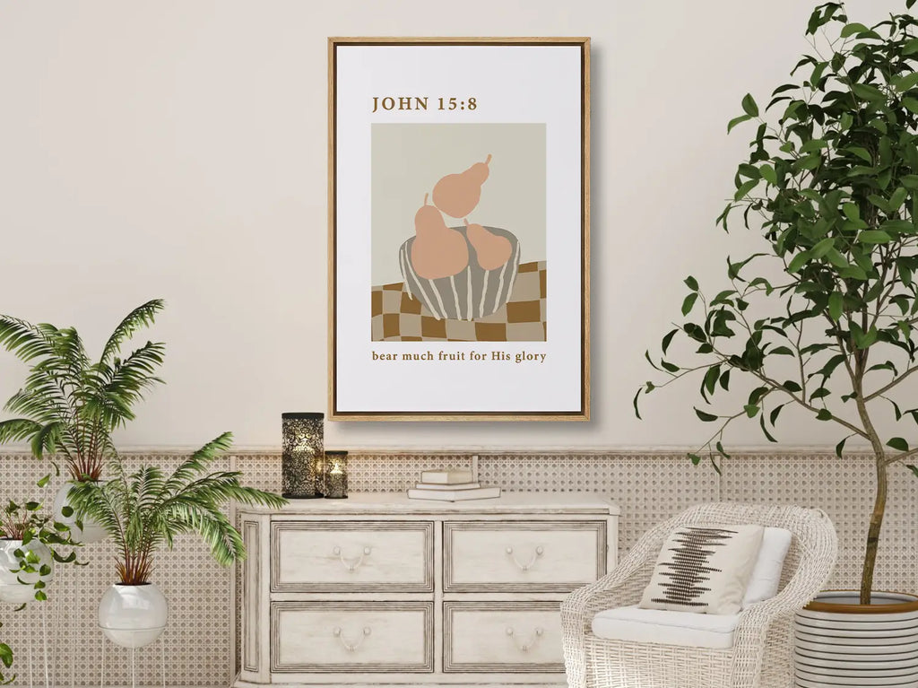 Minimalist Christian scripture wall art Bear Much Fruit hanging in a dining room