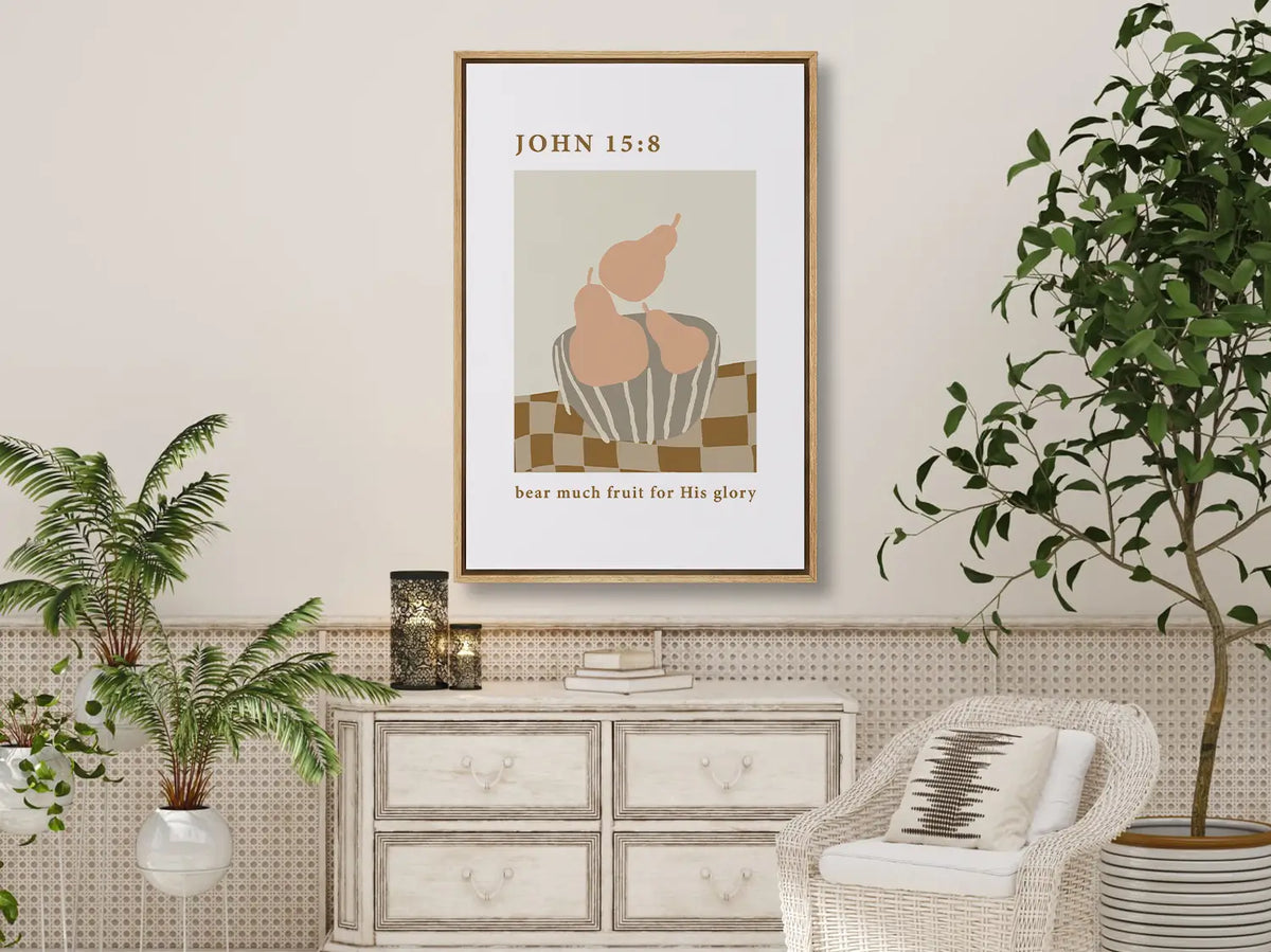 Minimalist Christian scripture wall art Bear Much Fruit hanging in a dining room