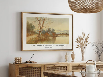 Cultivate a spirit of thankfulness in your home with this inspiring Christian wall art. This framed print features a warm, reflective autumn landscape paired with the powerful call to "Give thanks to the Lord, for he is good."