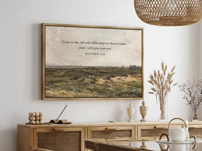 Invite true peace and rest into your home with this inspiring Christian wall art. This framed print features a classic landscape painting paired with the comforting invitation from Matthew 11:28: "Come to me, all who labor and are heavy laden, and I will give you rest."