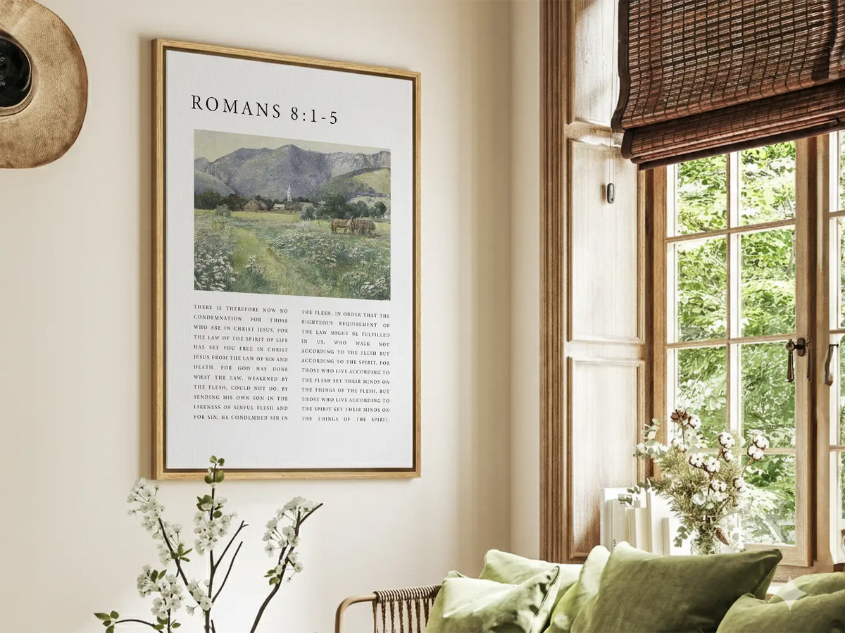 Close-up of Christian scripture canvas print with Romans 8:1–5 text and vintage landscape artwork.