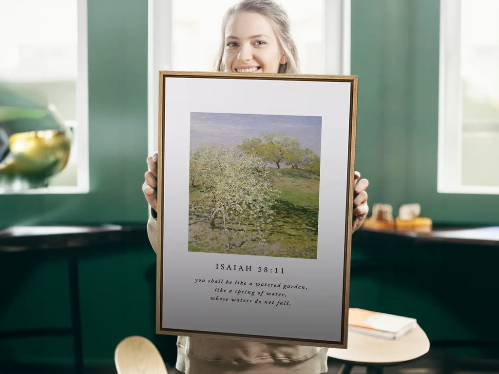 Invite the promise of unending provision into your home with this inspiring Christian canvas wall art. This framed canvas print features a beautiful orchard painting paired with the comforting promise from Isaiah 58:11 that you shall be like a "watered garden."