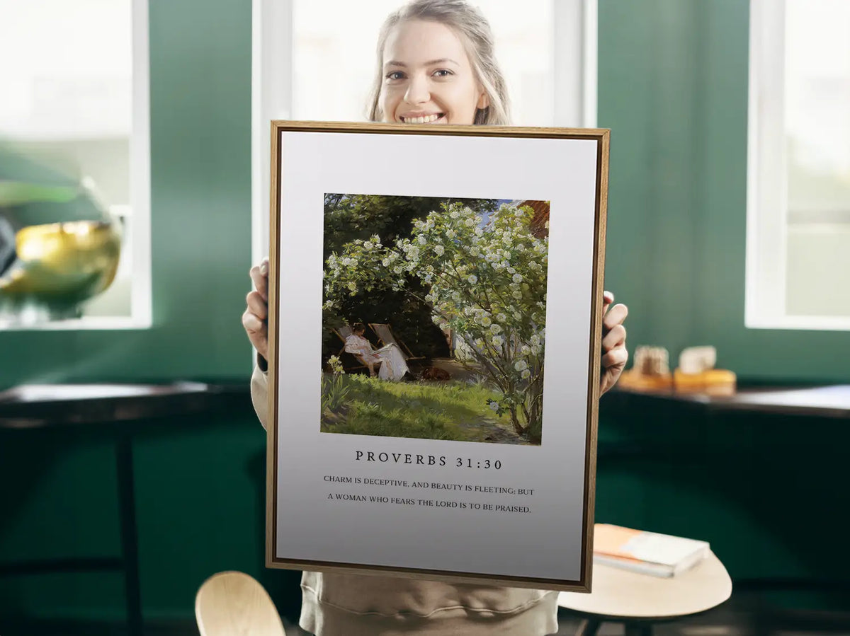 Celebrate inner strength and timeless beauty with this inspiring Christian canvas wall art. This framed canvas print features a peaceful garden scene paired with the profound scripture from Proverbs 31:30 about the enduring praise for a woman who fears the Lord.