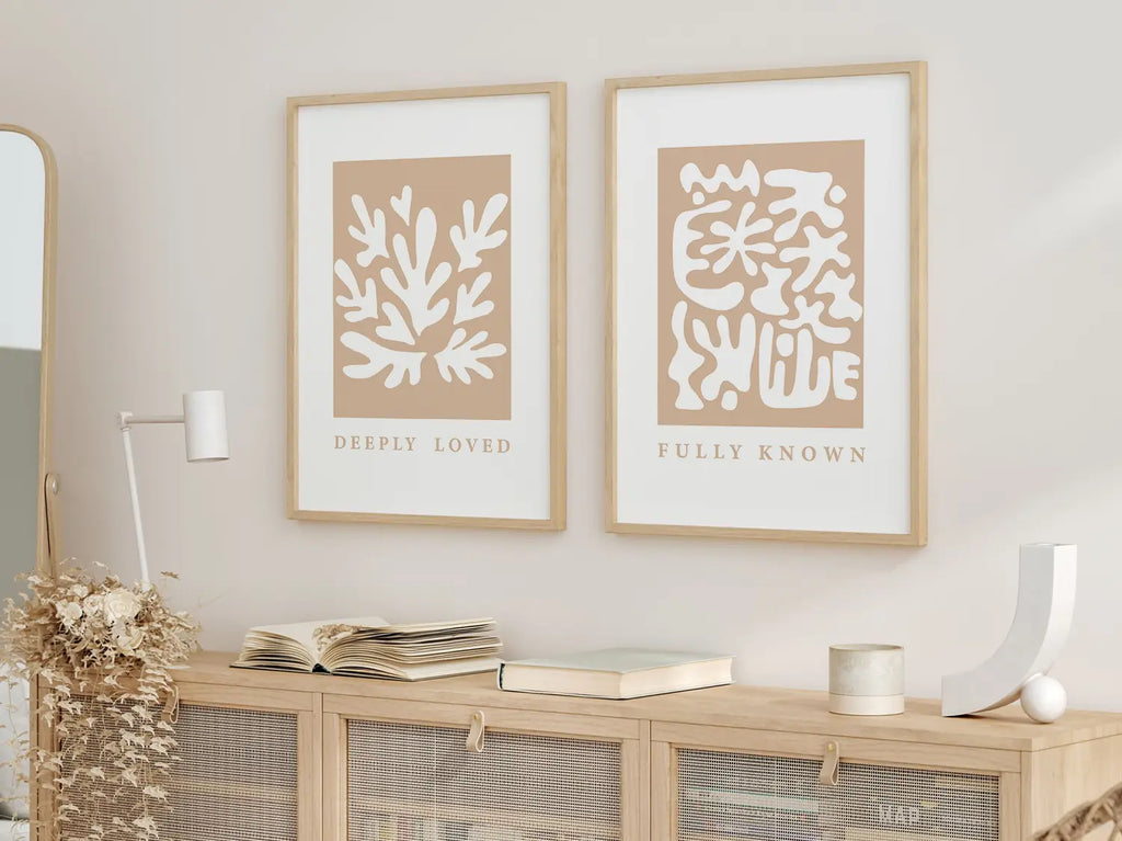 Decorate with faith and style using this inspiring, modern Christian wall art set. This collection of two framed abstract prints features a contemporary design and the comforting truth that you are Deeply Loved & Fully Known by God.