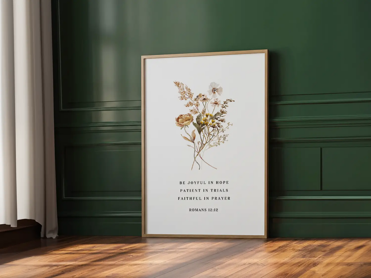 Anchor your heart in hope and resilience with this inspiring Christian canvas wall art. This framed canvas print features a beautiful pressed floral illustration paired with the powerful encouragement from Romans 12:12 to be joyful, patient, and faithful.