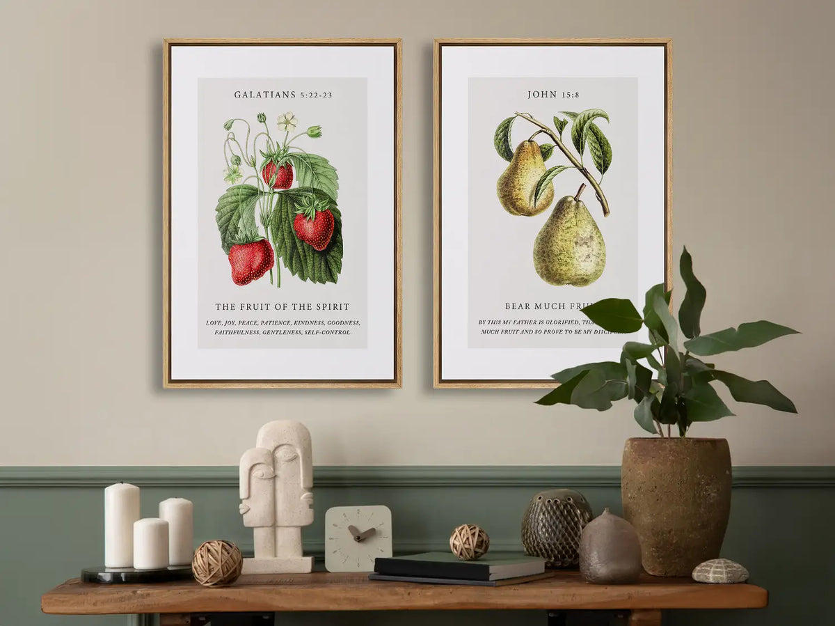 Decorate your home with this beautiful Christian wall art set. This collection of two framed botanical prints features detailed illustrations of fruit, paired with powerful verses on the Fruit of the Spirit and bearing spiritual fruit.