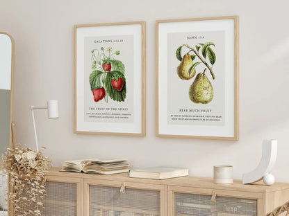 Decorate your home with this beautiful Christian wall art set. This collection of two framed botanical prints features detailed illustrations of fruit, paired with powerful verses on the Fruit of the Spirit and bearing spiritual fruit.