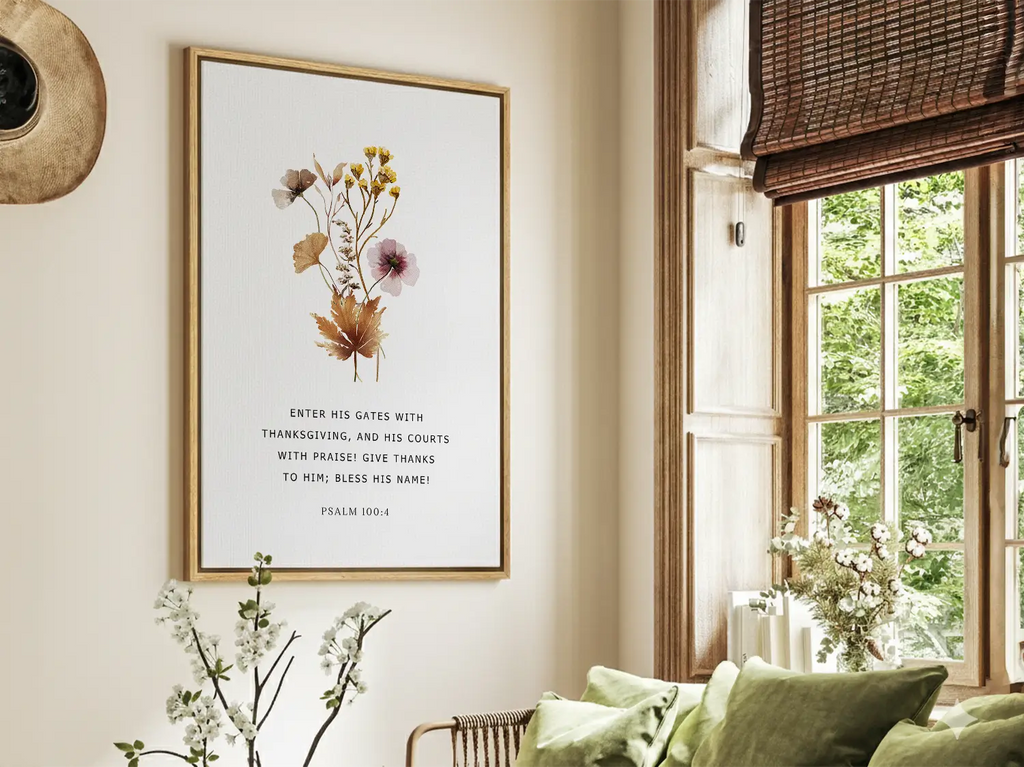 Cultivate a spirit of joyful gratitude with this inspiring Christian canvas wall art. This framed canvas print features a delicate, pressed floral design paired with the iconic command from Psalm 100:4 to enter God's presence with thanksgiving.
