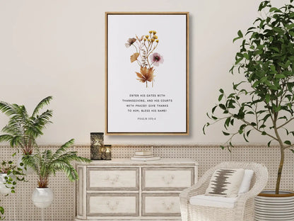 Cultivate a spirit of joyful gratitude with this inspiring Christian canvas wall art. This framed canvas print features a delicate, pressed floral design paired with the iconic command from Psalm 100:4 to enter God's presence with thanksgiving.