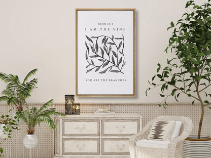Anchor your home in the source of life and fruitfulness with this inspiring Christian canvas wall art. This framed canvas print features a modern, hand-drawn vine illustration and the essential truth from John 15:5: "I am the vine; you are the branches."