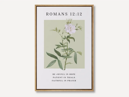 Anchor your heart in hope and resilience with this inspiring Christian canvas wall art. This framed canvas print features a calming botanical illustration paired with the powerful encouragement from Romans 12:12 to be joyful, patient, and faithful.