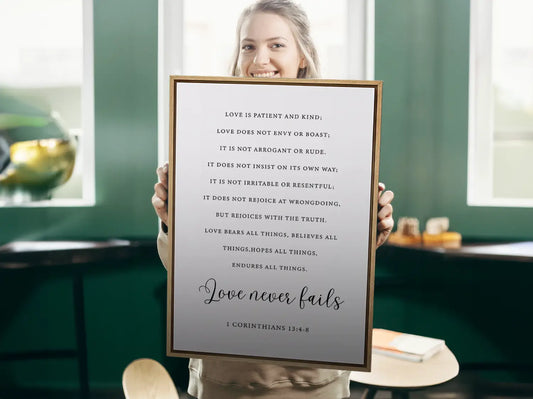 Anchor your home in Christ's unwavering love with this inspiring Christian canvas wall art. This framed canvas print features the complete, profound text of 1 Corinthians 13:4-8, highlighting the powerful truth that Love never fails.