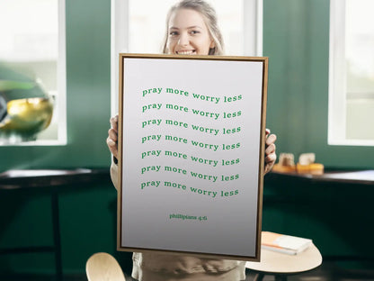 Find daily peace and encouragement with this inspiring Christian canvas wall art. This framed canvas print features a fun, repeating typographic design and the powerful instruction from Philippians 4:6 to Pray more worry less.