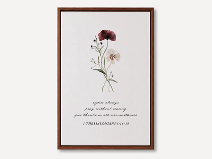 Anchor your heart in daily joy and gratitude with this inspiring Christian canvas wall art. This framed canvas print features a delicate watercolor floral illustration paired with the essential life commands from 1 Thessalonians 5:16-18.