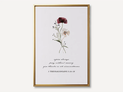 Anchor your heart in daily joy and gratitude with this inspiring Christian canvas wall art. This framed canvas print features a delicate watercolor floral illustration paired with the essential life commands from 1 Thessalonians 5:16-18.