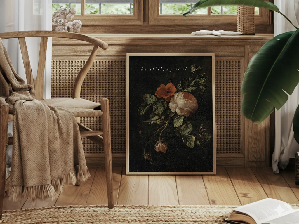 Invite deep tranquility and faith into your home with this inspiring Christian canvas wall art. This framed canvas print features a dramatic, dark floral painting paired with the comforting command: “Be still, my soul.”